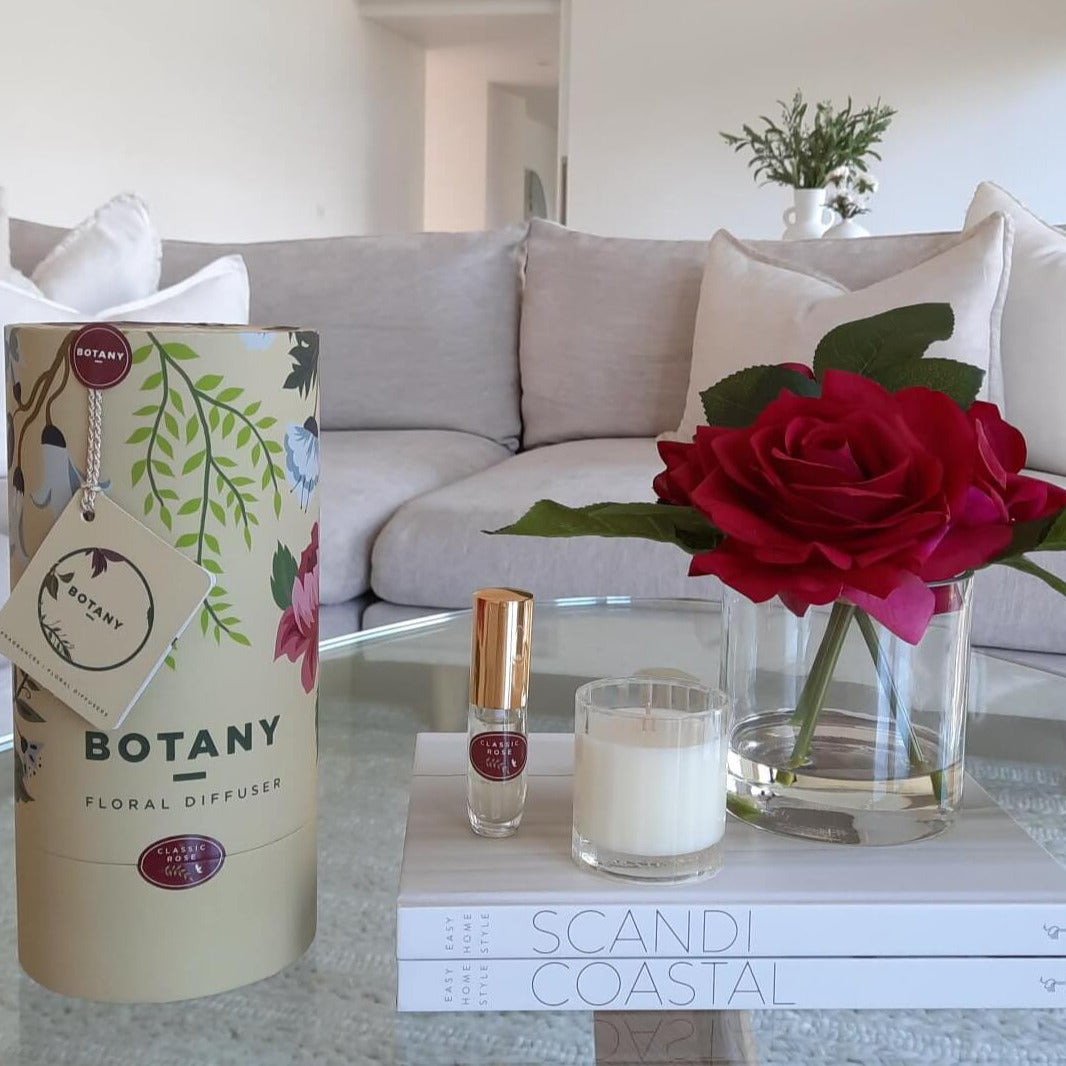 fake rose flowers and perfume spray