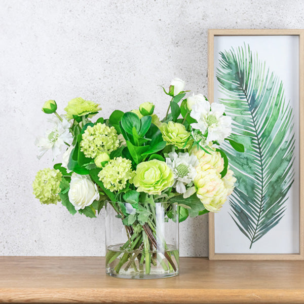 Fake greens and white flowers