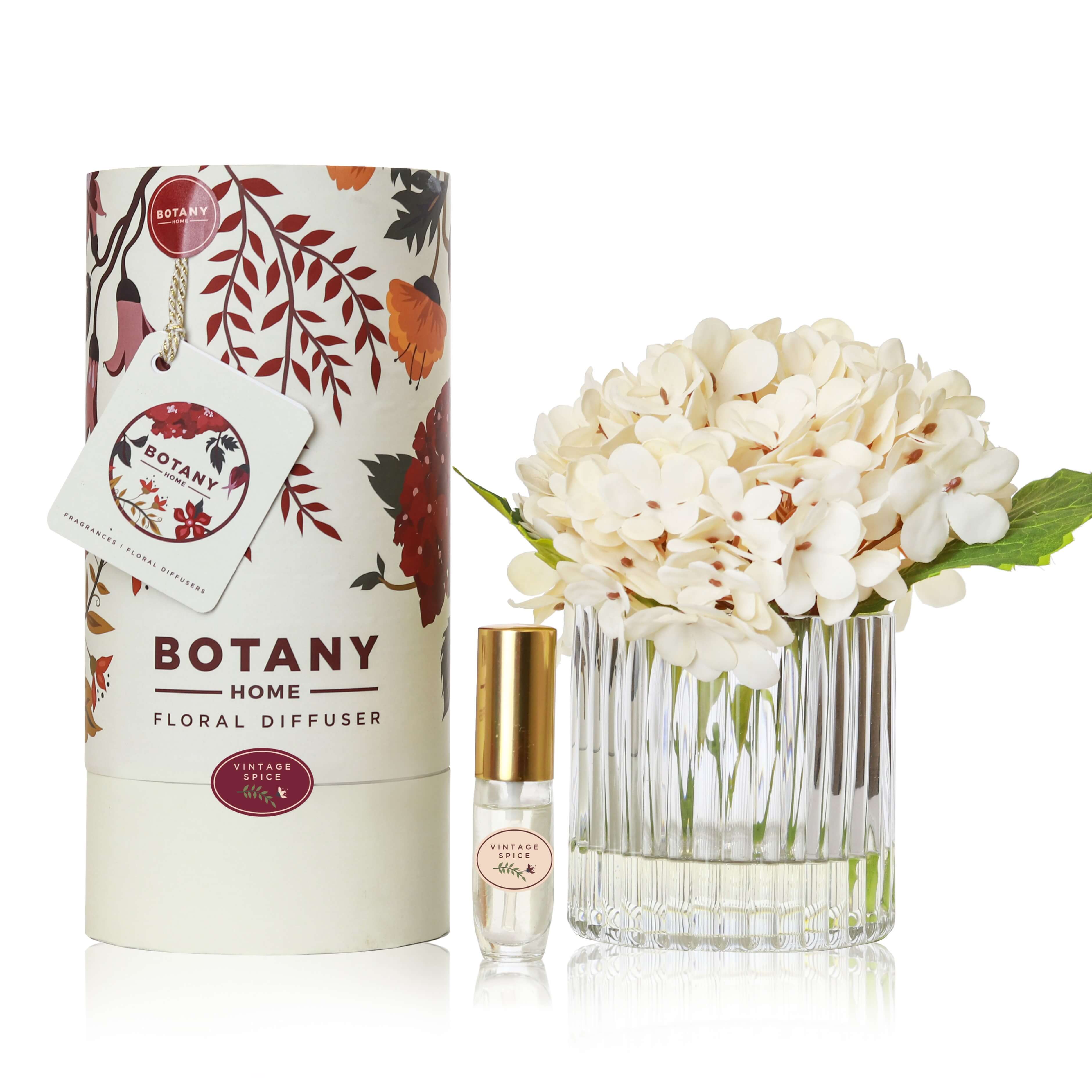 An artificial cream hydrangea flower arrangement paired with a floral scent spray