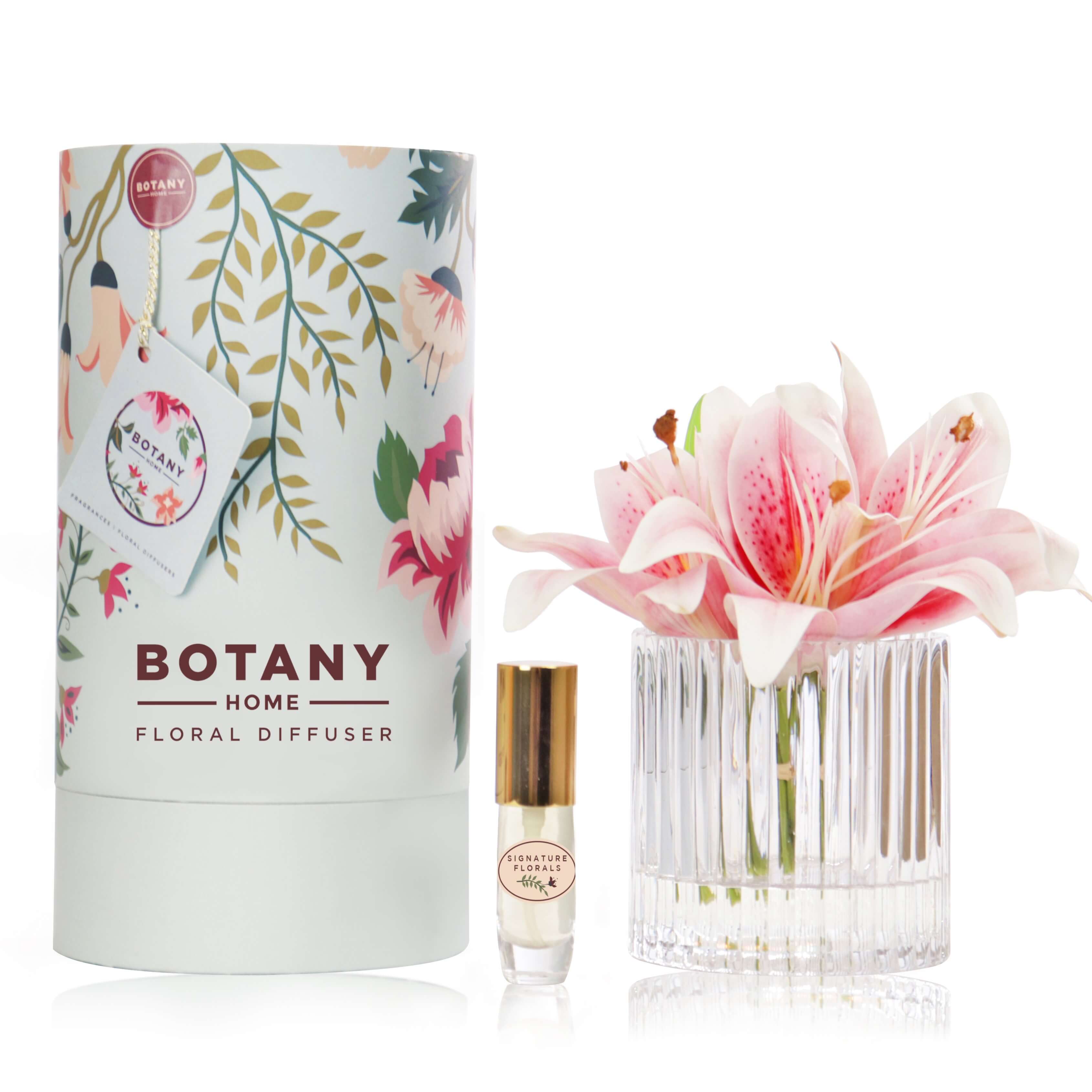 Artificial pink lily arrangement paired with a floral fragrance spray