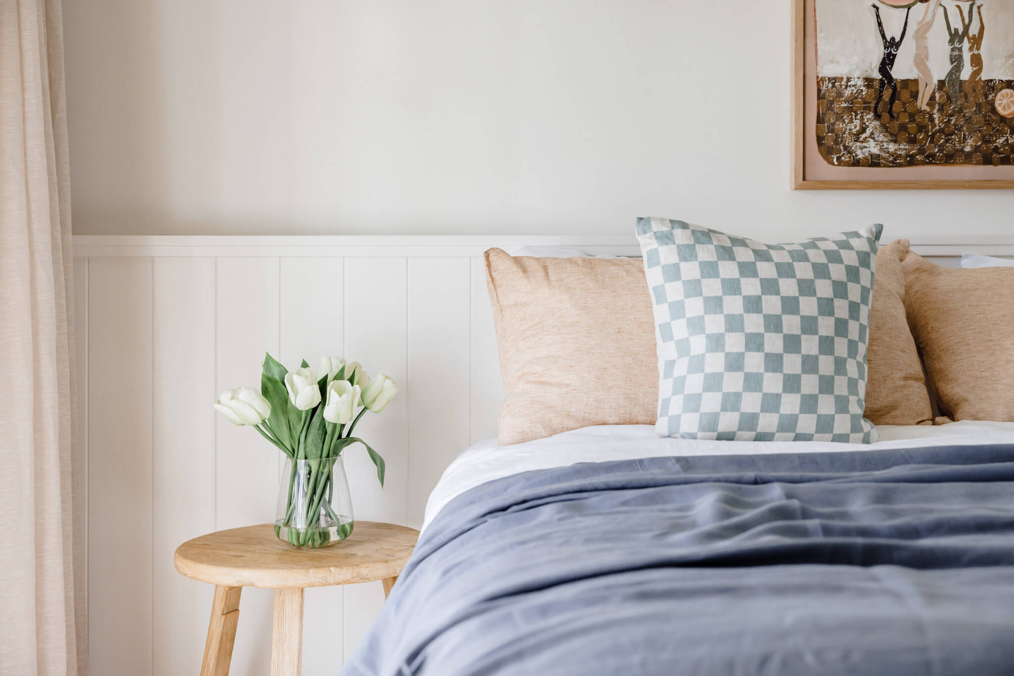 Artificial lime tulip flowers on a bedside table