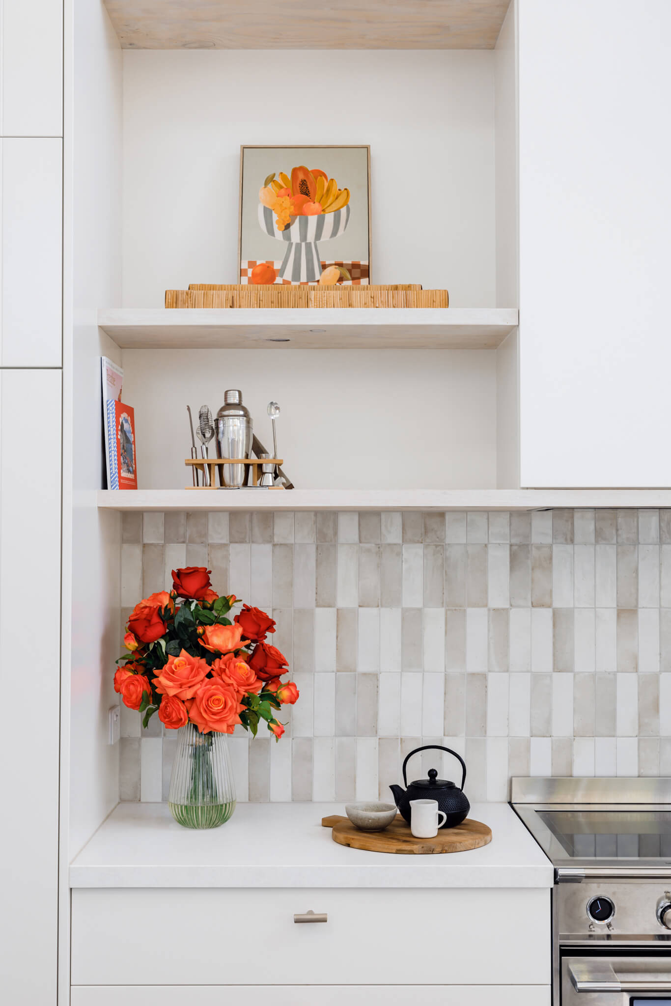 Tall artificial flower arrangement in kitchen