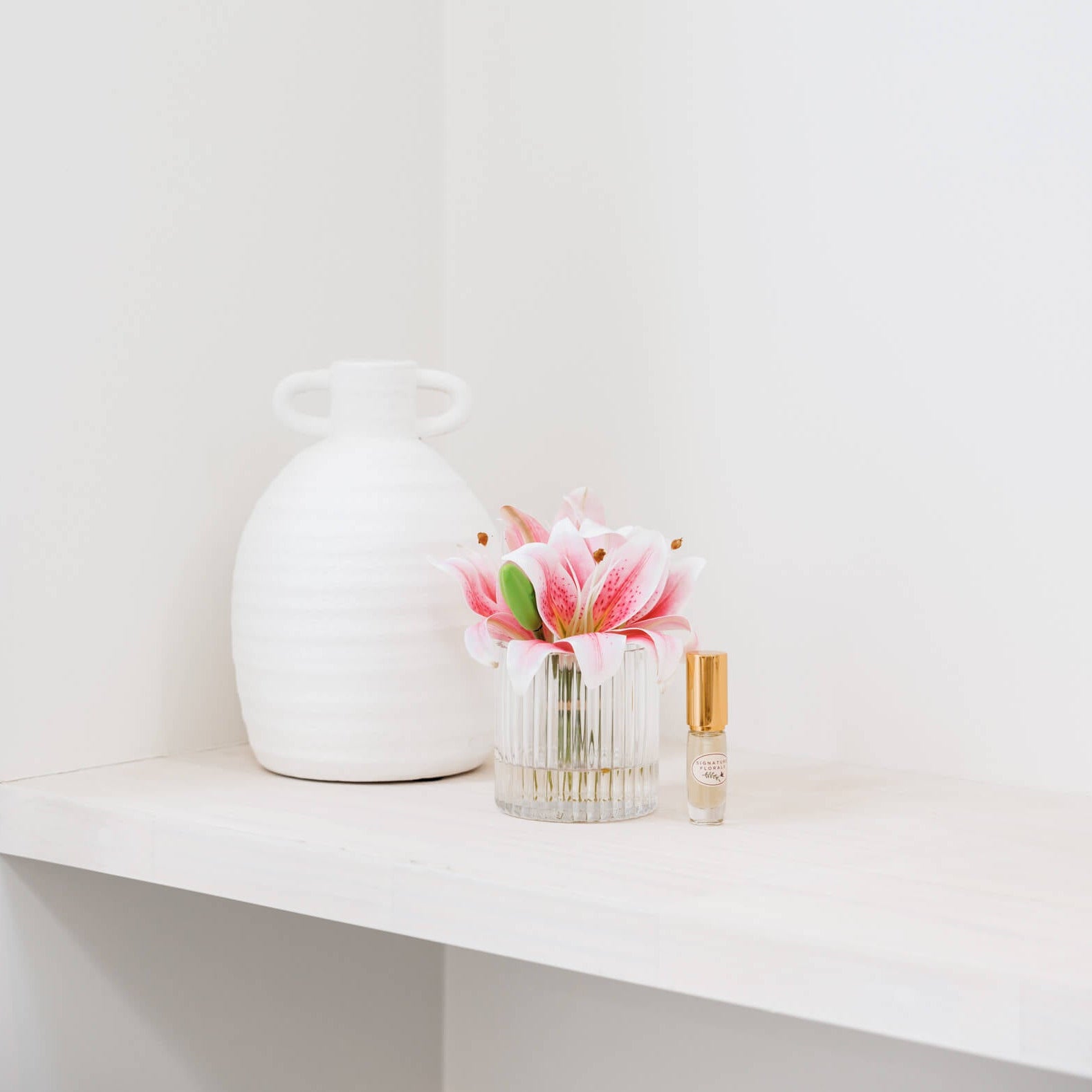 Fake flowers in vase with lily fragrance