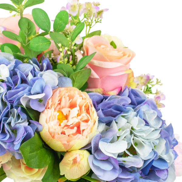 plastic hydrangea flower arrangement in glass vase