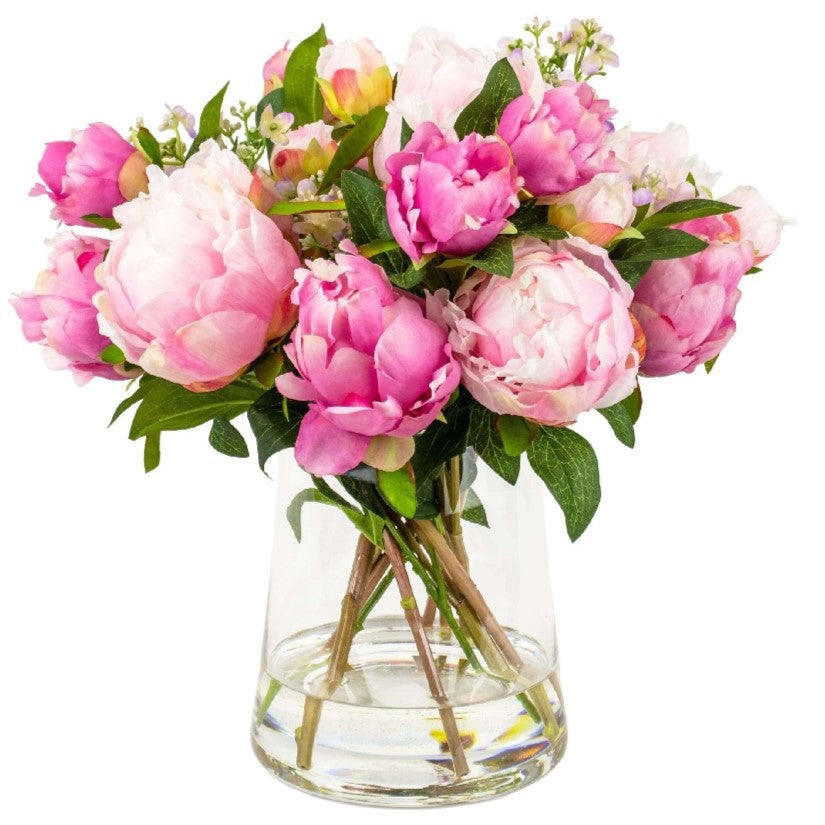 Artificial pink peony arrangement set in resin in a glass vase