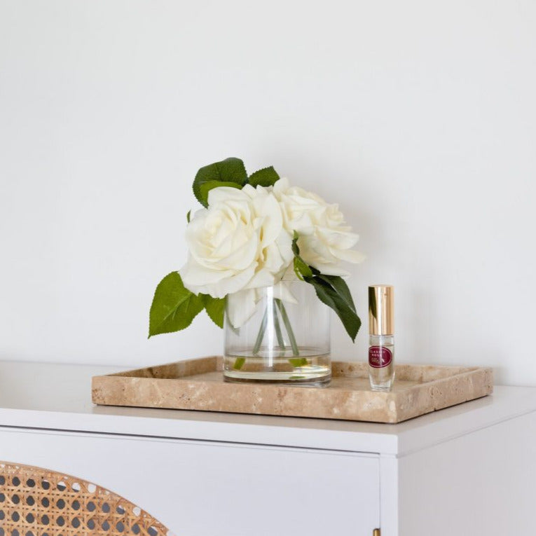 3 cream fake roses in glass vase with floral perfume