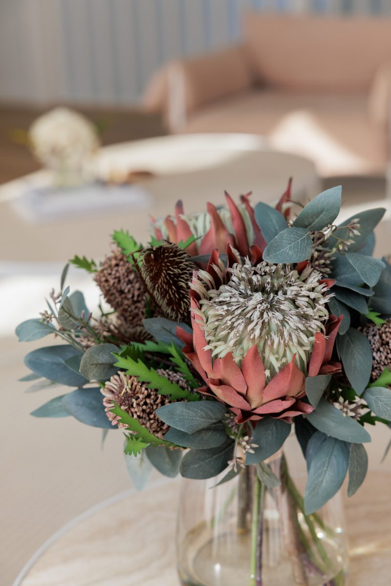Fux flower arrangement with silk protea flowers