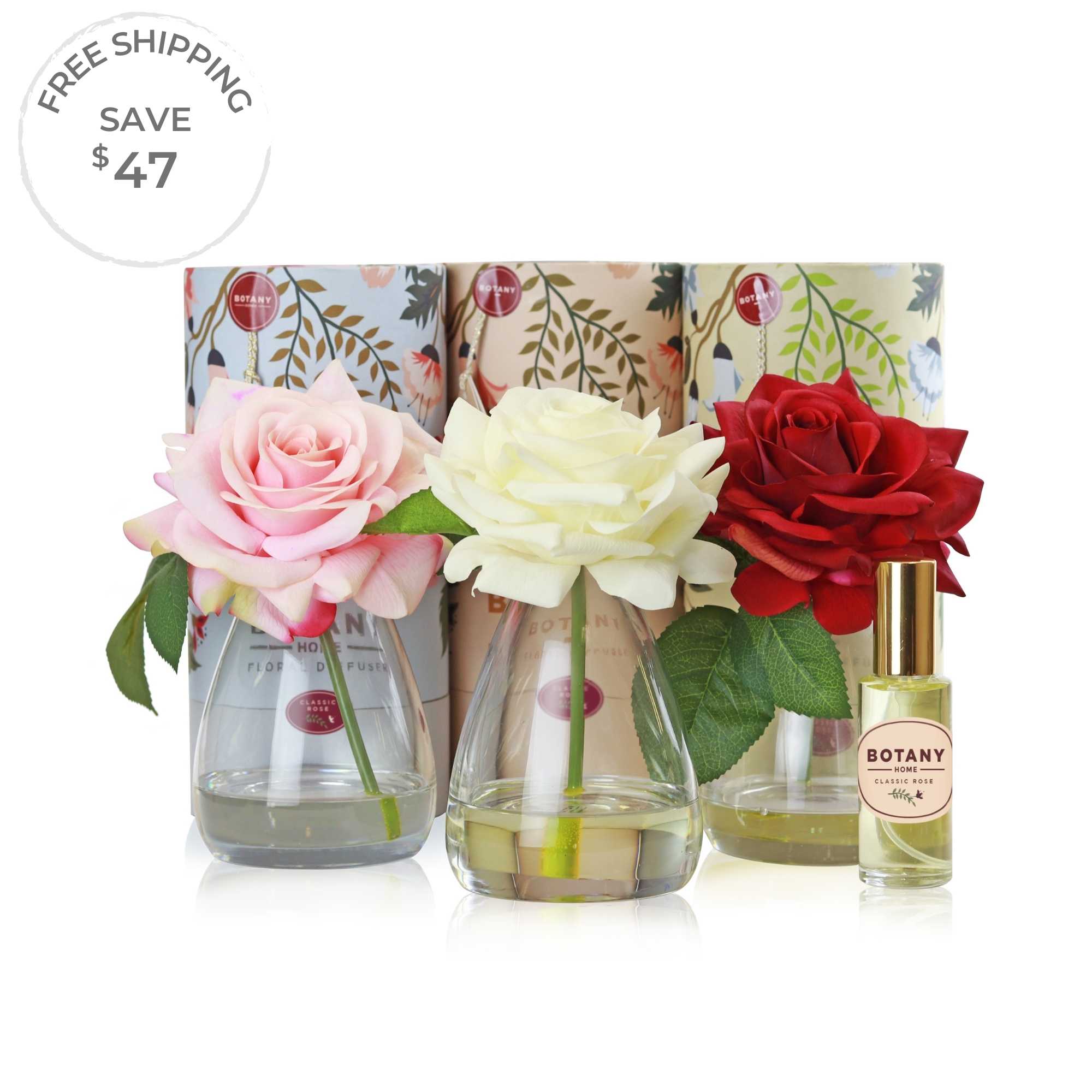 A set of 3 artificial rose arrangements with accompanying floral scent sprays sold as a set of 3