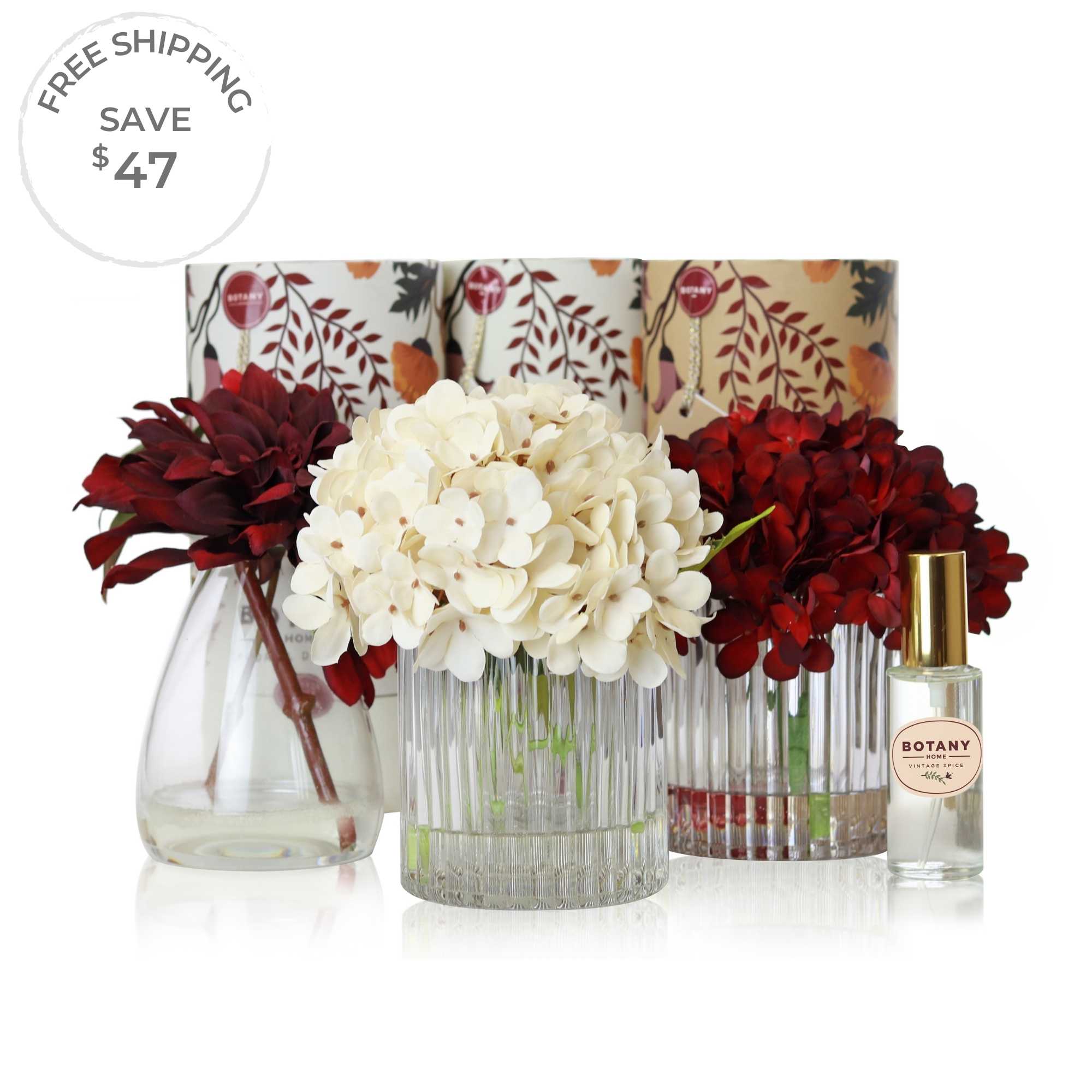 A set of 3 artificial flower arrangements with accompanying floral scent sprays sold as a set of 3