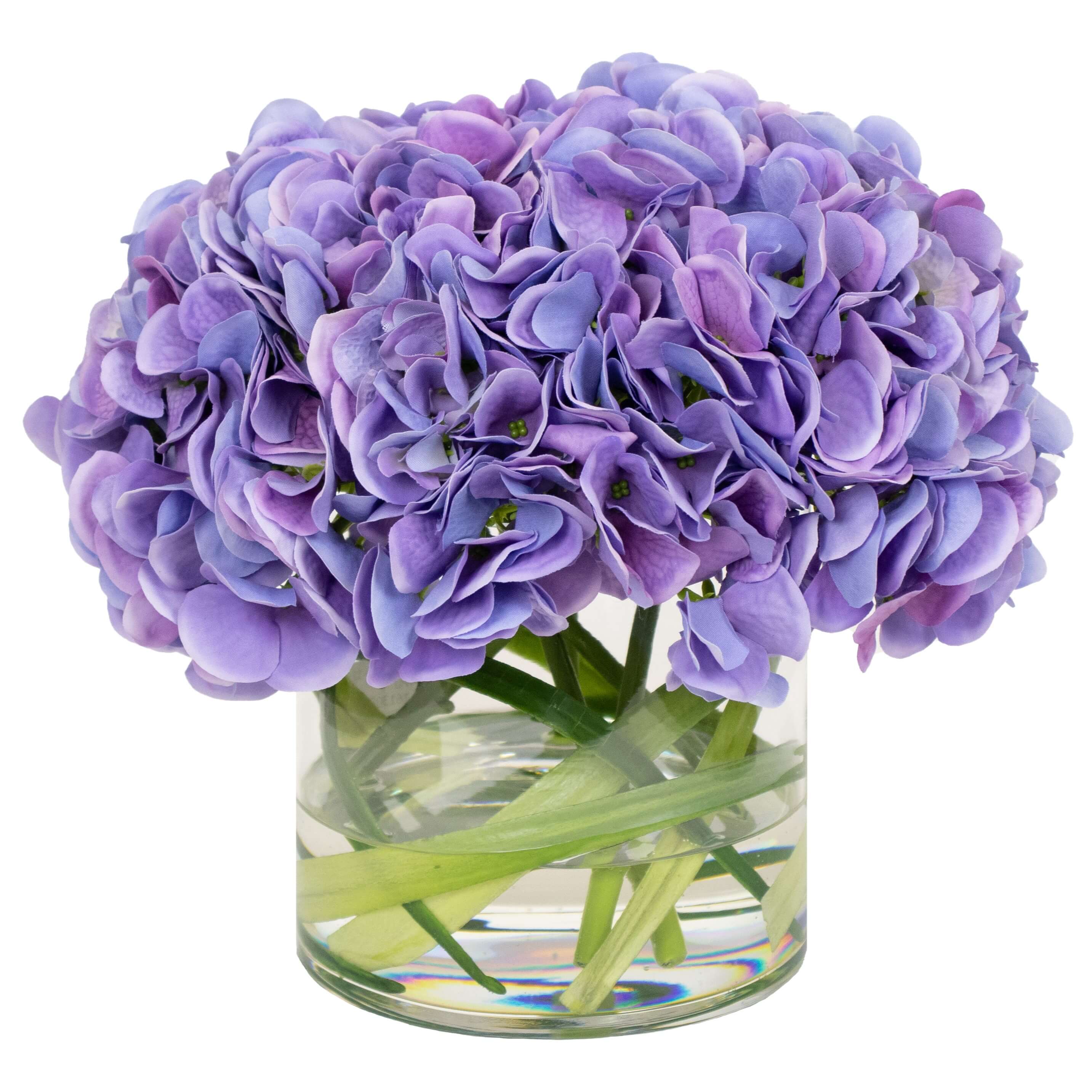 Fake hydrangea flower arrangement in glass vase