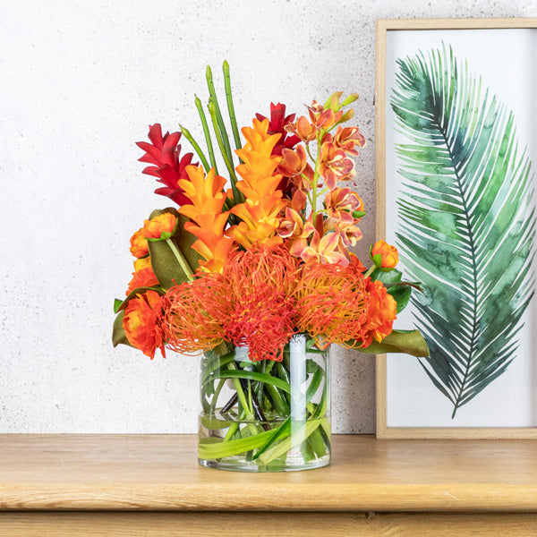 Fake flower arrangement in glass vase