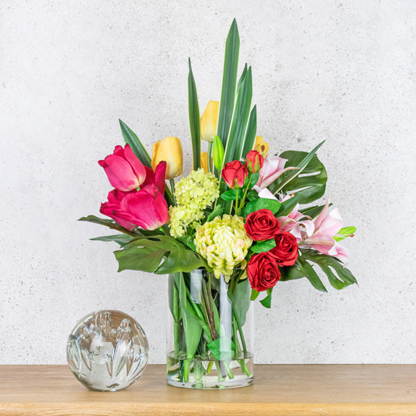 Artificial flower arrangement using tulips and lilies