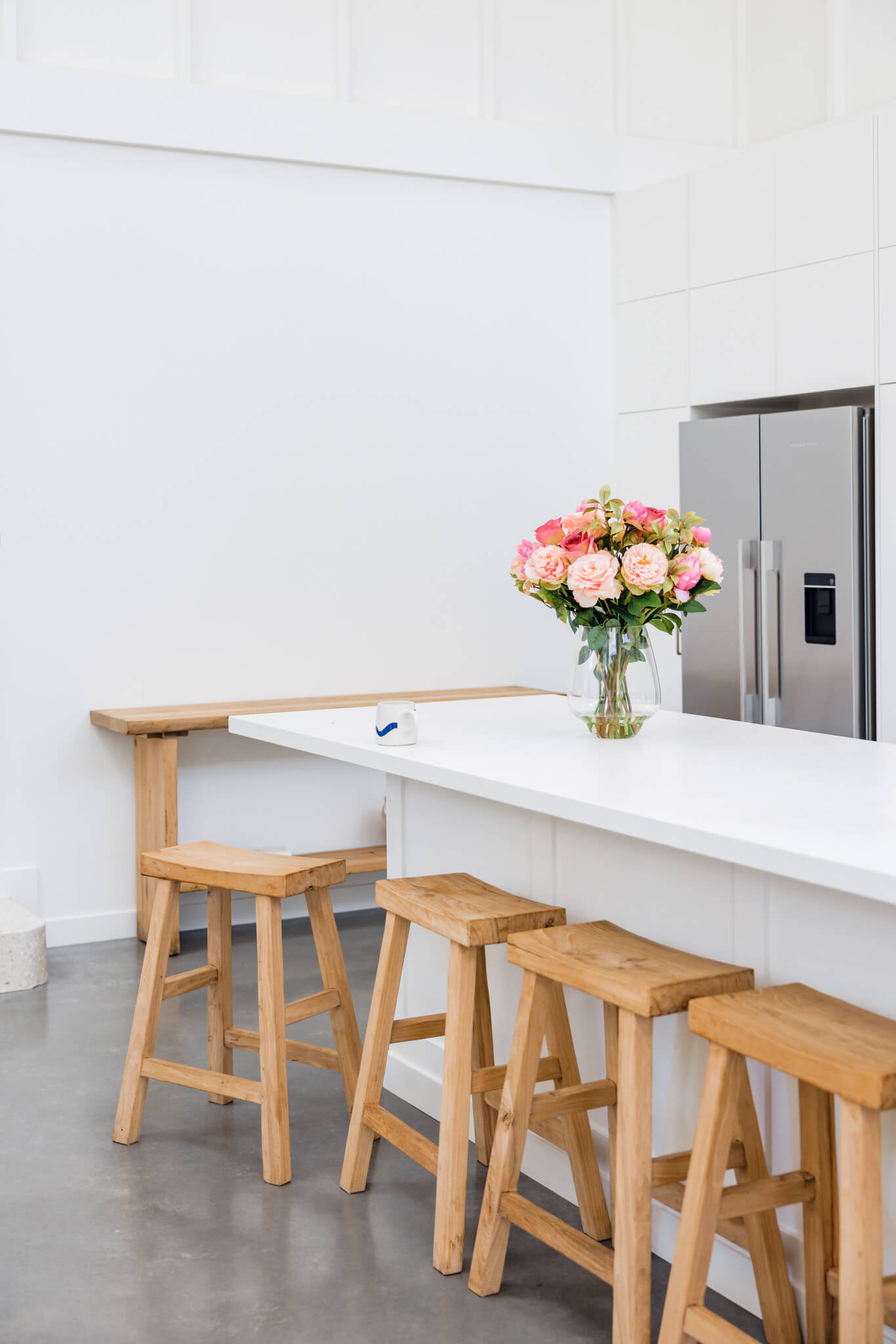 Artificial flower arrangement positioned in kitchen