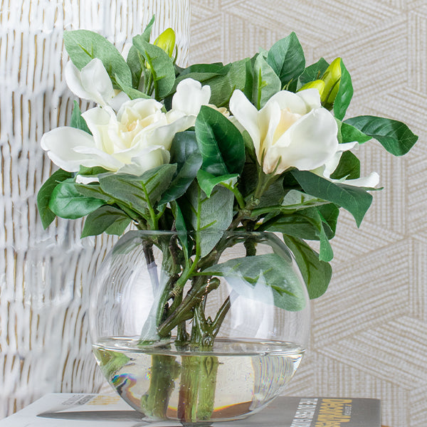 silk gardenia flowers in glass vase arrangement