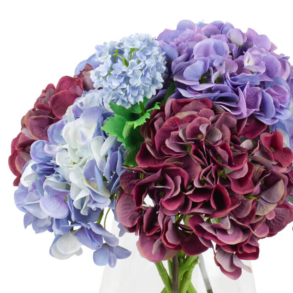 silk hydrangeas set in a glass vase