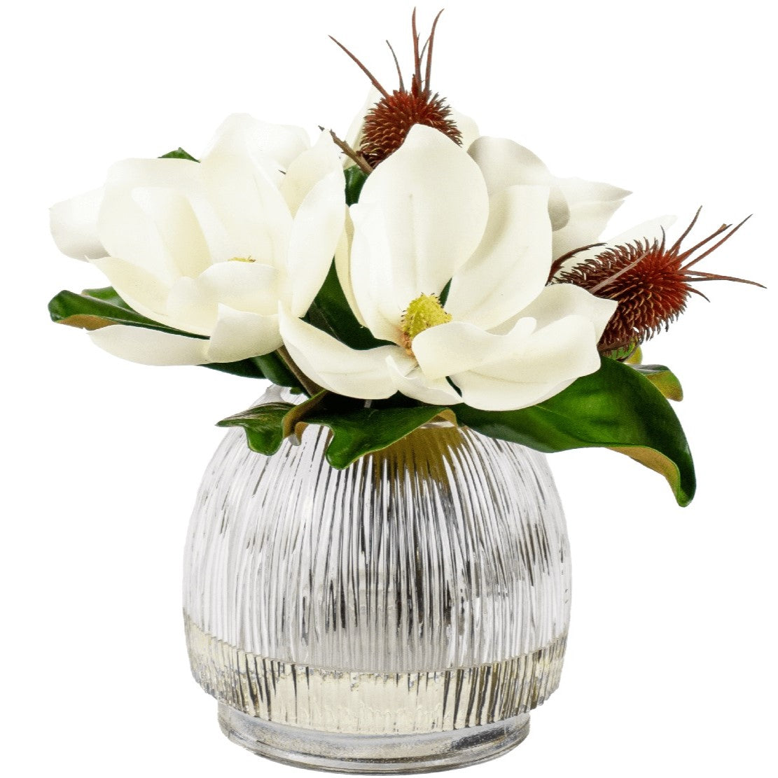 artificial magnolia flower arrangement in glass vase