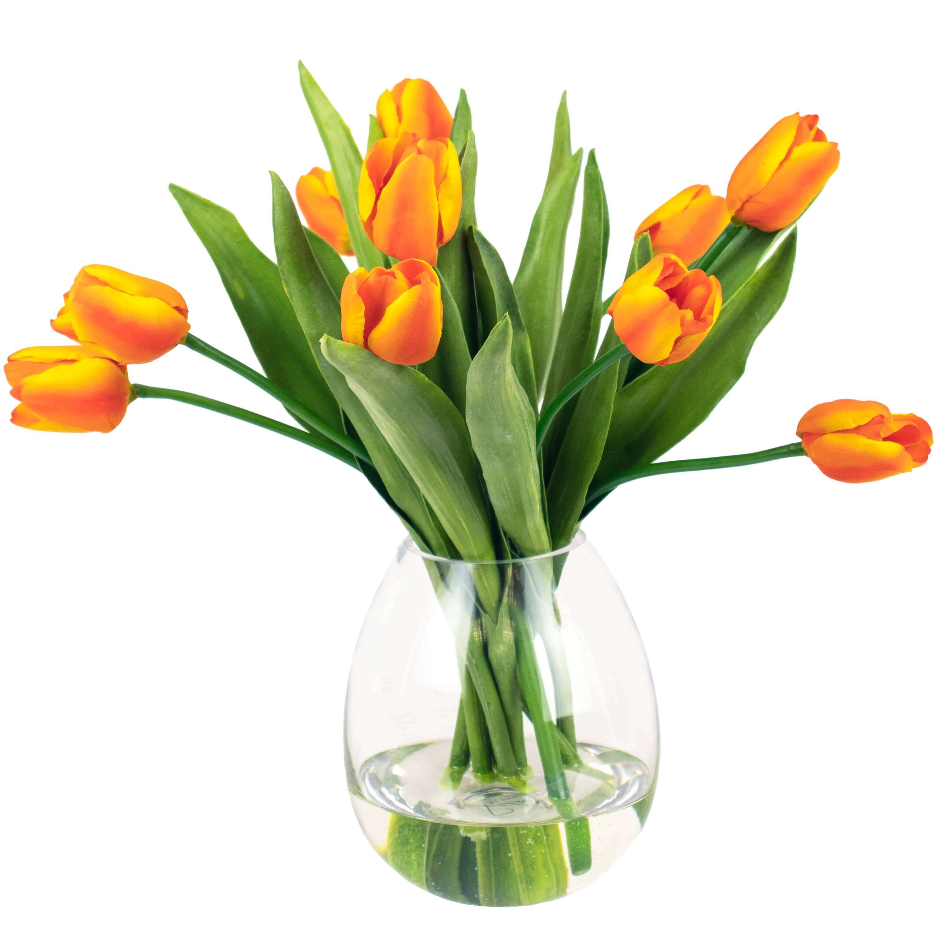 artificial orange tulip flowers in glass vase