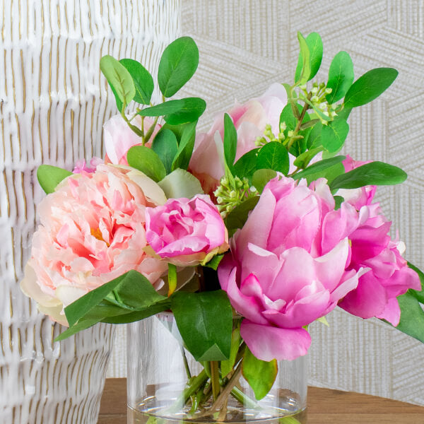 close up shot of artificial pink peony flower arrangement