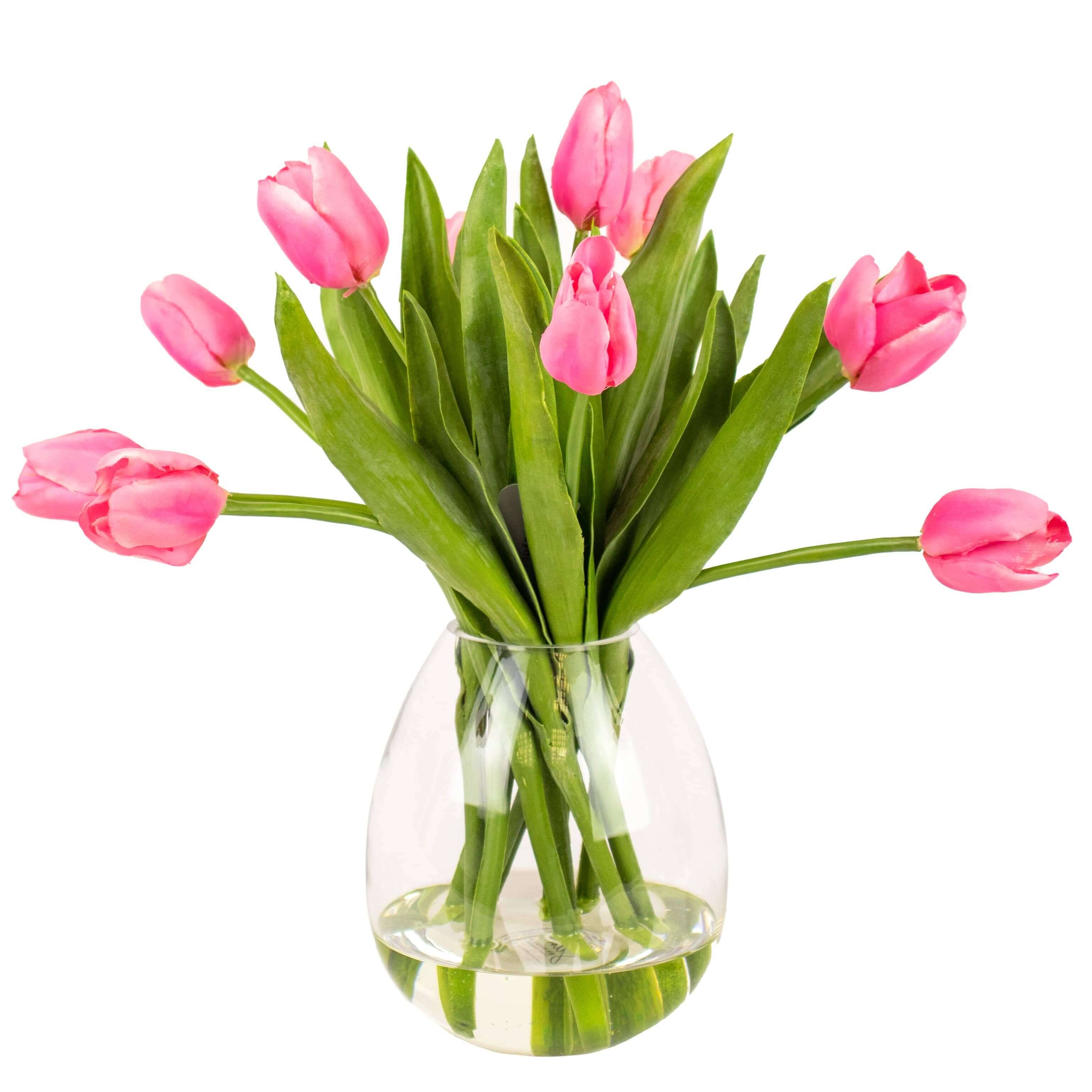 artificial pink tulip flowers in glass vase