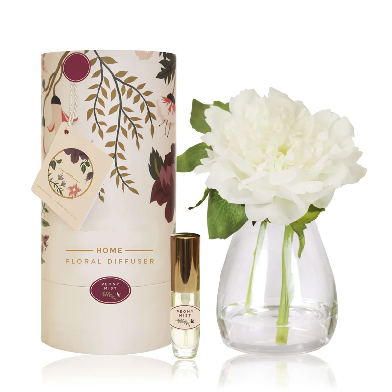 An artificial white Peony flower arrangement paired with a floral scent spray