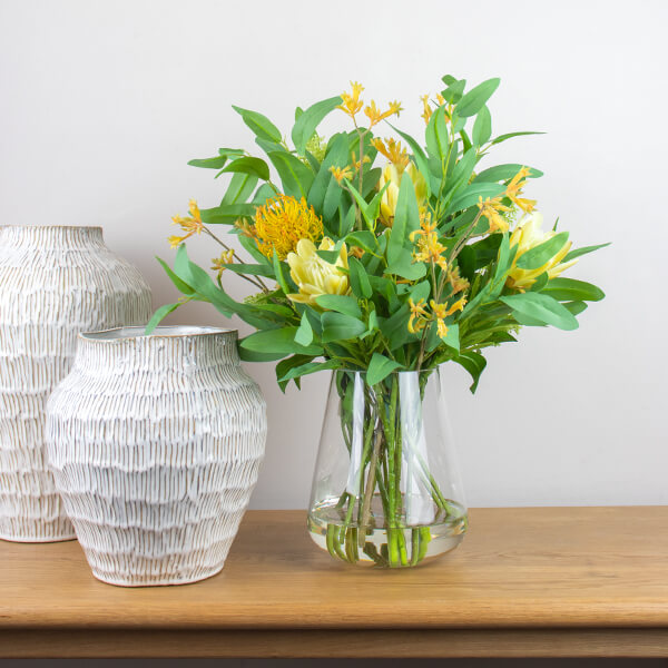 fake flower arrangement on table