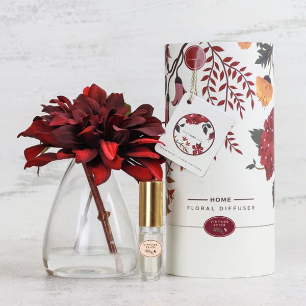 Fake dahlia flower in glass vase with floral perfume and packed in a gift box