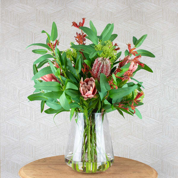 silk flower bouquet in glass vase