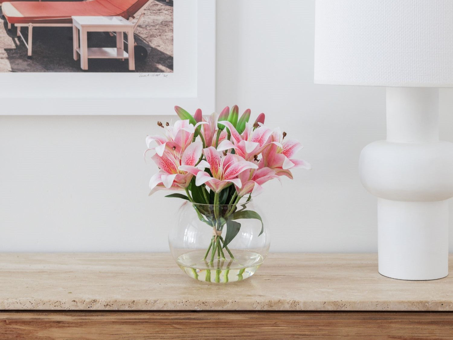 pink lily flowers in glass vase