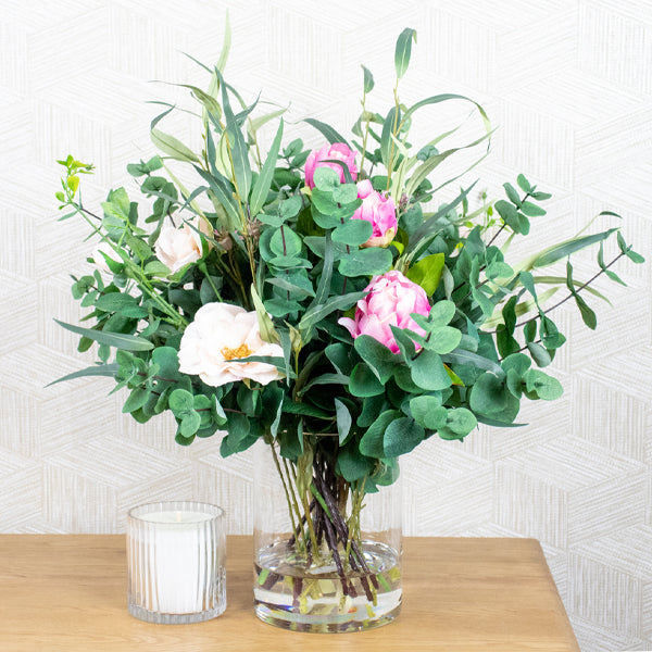 Fake native flowers in glass vase