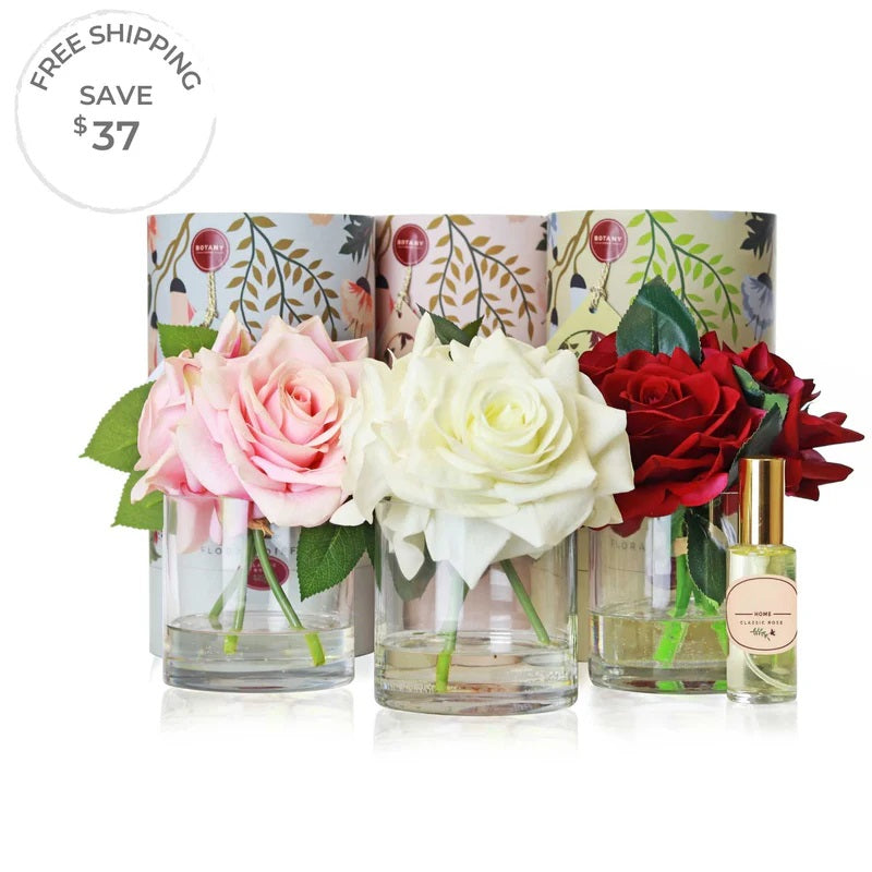 A set of 3 artificial triple rose arrangements with accompanying floral scent sprays sold as a set of 3