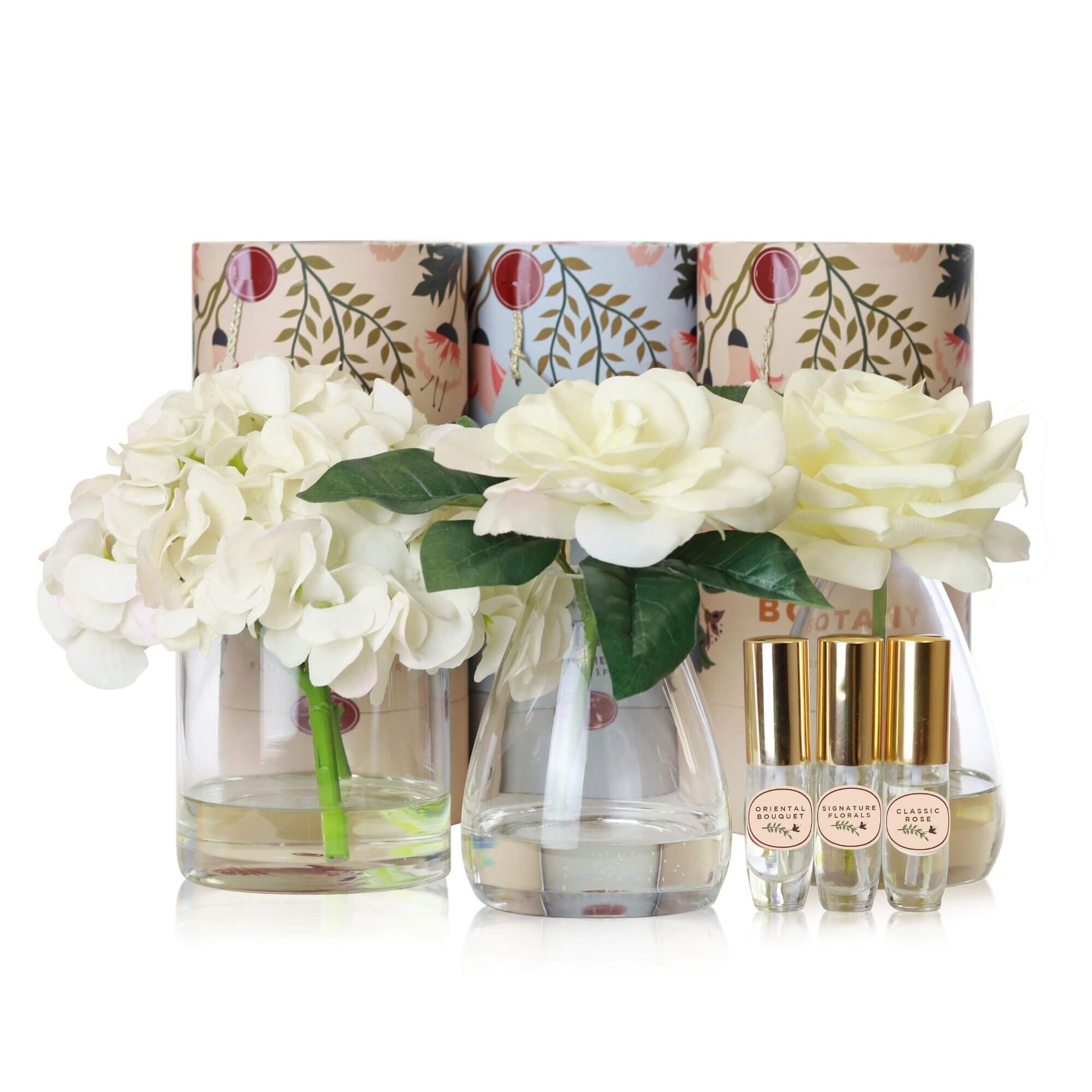 A set of 3 artificial white flower arrangements with accompanying floral scent sprays sold as a set of 3