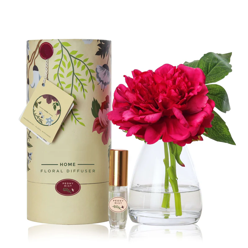 An artificial dark pink Peony flower arrangement paired with a floral scent spray