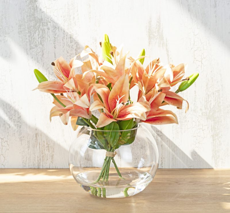 An orange silk lily arrangement that is for sale online in Australia