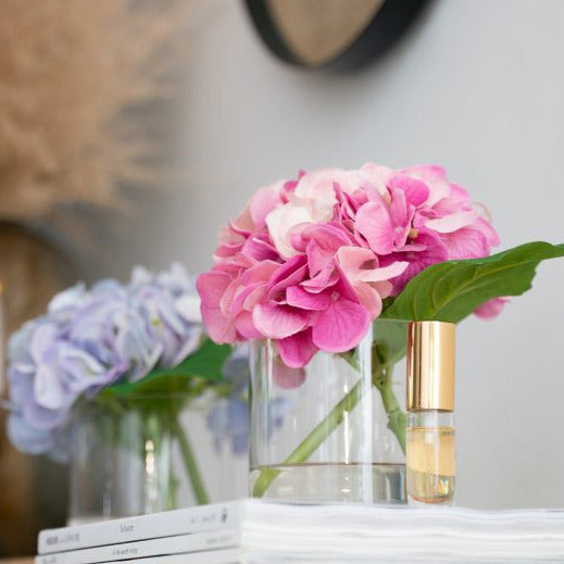 Silk hydrangeas in glass vases