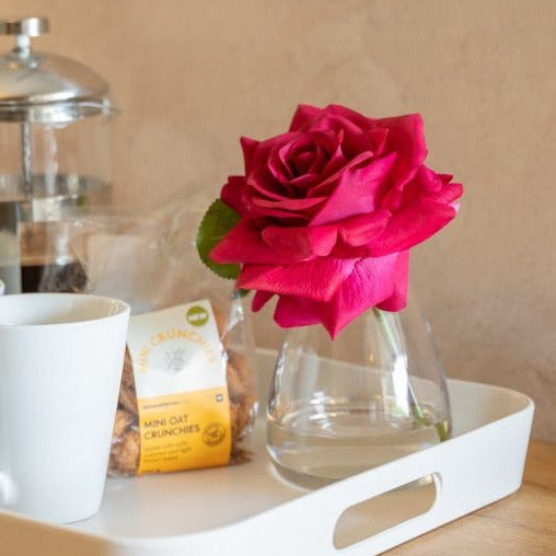 Artificial red rose flower box diffuser paired with a rose fragrance spray