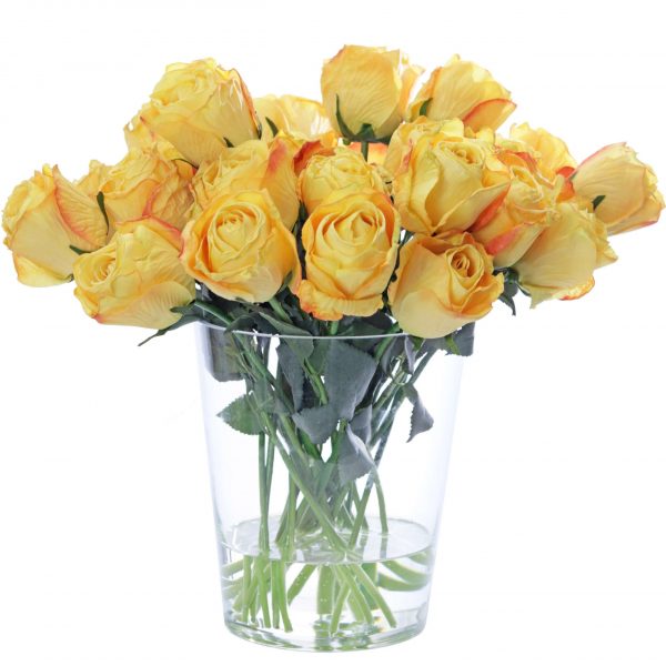 Artificial yellow rose arrangement in glass vase