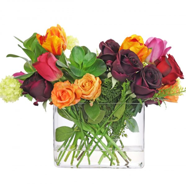 Artificial mixed rose arrangement set in a rectangle glass vase