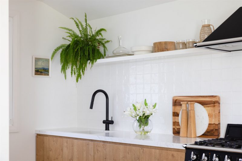 An arrangement of white silk lilies being displayed in a kitchen of an Australian home