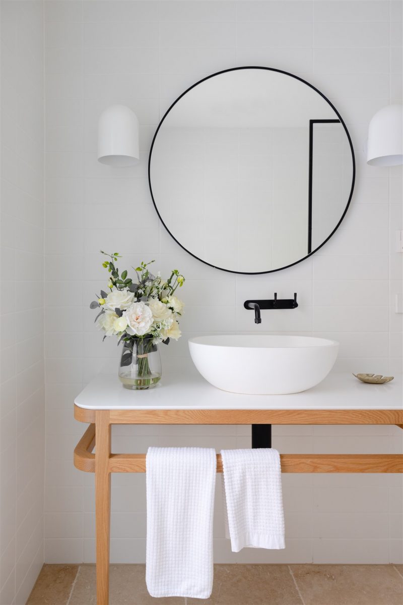 Artificial flower arrangement in a bathroom