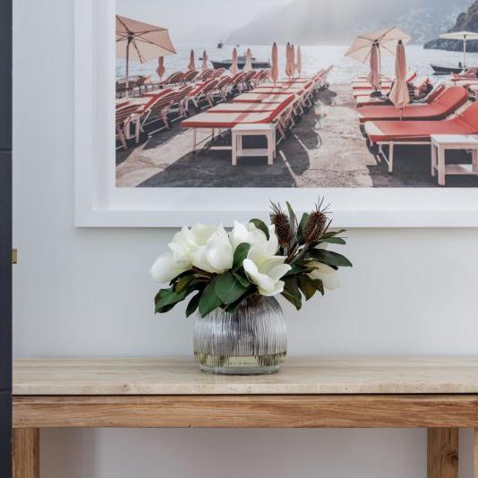 A silk bouquet of hydrangea flowers being displayed in a home