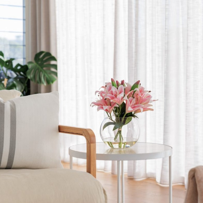 Silk tiger lily bowl sitting on side table in an Australian home for decorative purposes