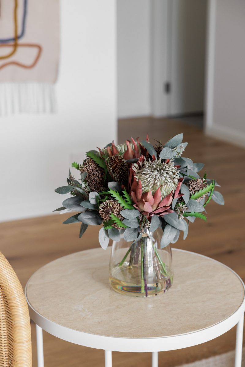 Australian native silk flowers set in resin in a glass vase